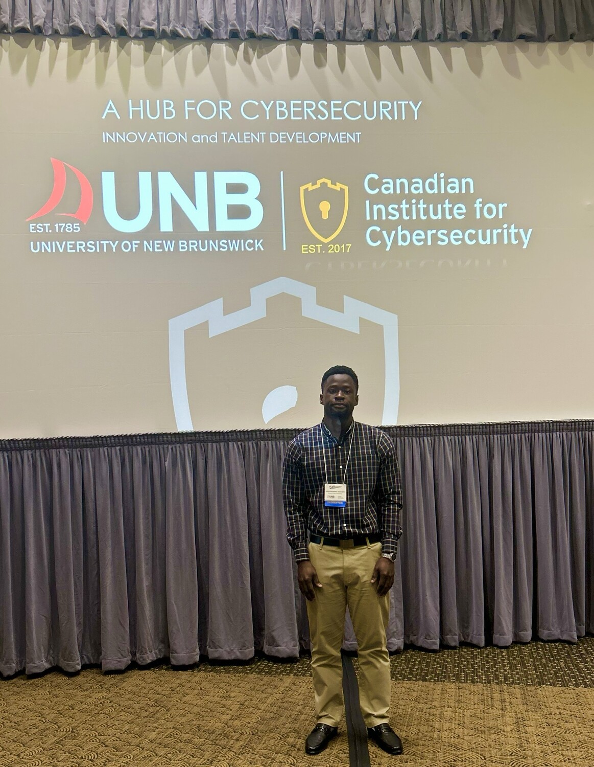 Aghoghomena Akasukpe, Cybersecurity & AI Researcher at Ontario Tech University, at the #PST2025 Industry Summit. His accepted research paper at the conference explored novel defense strategies against data poisoning in machine learning systems.