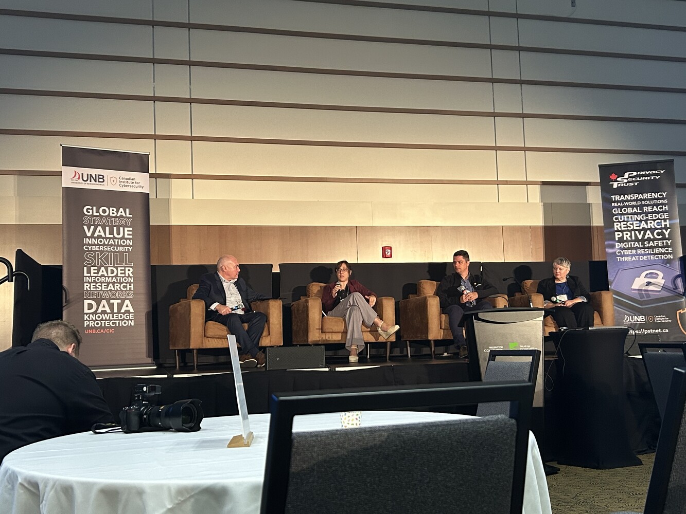 Panel discussion on cyber attribution and global security, featuring Dr. Argyri Panezi, Kelly Anderson, Kostiantyn Nikolaiev, and Colin MacSween (Moderator), with Dr. Ahmed Al-Rawi contributing virtually.